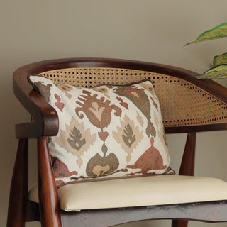 brown and cream cushion on wooden chair