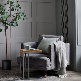 Grey throw over grey armchair