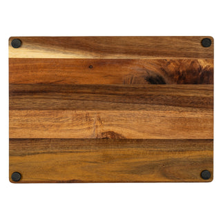 Overhead view of the acacia board's base, highlighting the wood grain and four black anti-slip rubber feet.