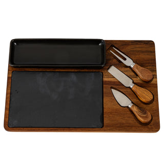 Overhead view of the acacia cheese board set with slate insert, rectangular black dish, and three wooden-handled cheese cutlery pieces.