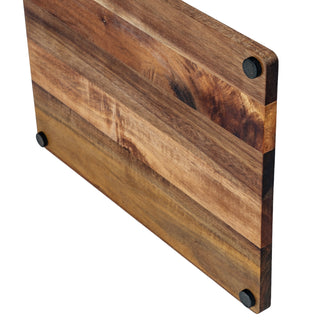 Detail shot of the acacia board's edge, highlighting the wood grain, construction, and anti-slip rubber feet.