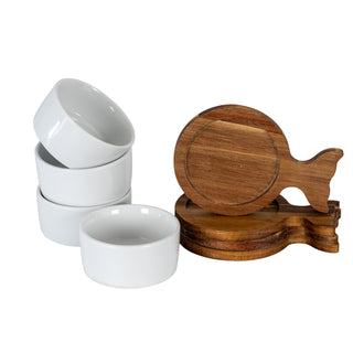 Four white ceramic bowls stacked beside four stacked acacia wood fishtail trays.