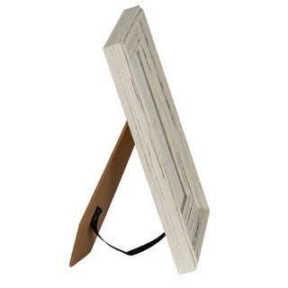 Side view showing the frame depth and the easel back support with the black ribbon strap.