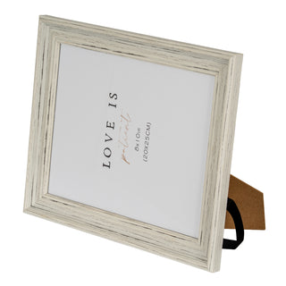 Angled view of the grey wood-effect frame, highlighting the distressed texture and profile.