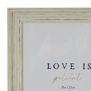 Close-up of the top-left corner of the frame, showing the mitred joint and the pale grey distressed wood finish.