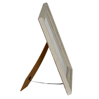 Side profile of the frame showing the easel stand and the string limiting its angle.