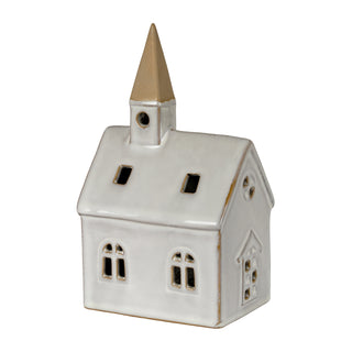 Glossy white ceramic church ornament featuring cut-out windows and a contrasting beige spire.