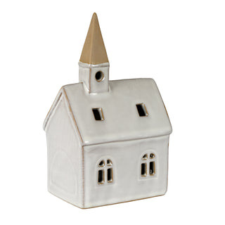 Three-quarter view of the ceramic church showing the arched windows and square roof vents.