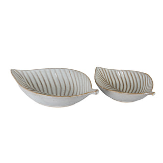 Large and small ceramic leaf dishes displayed side-by-side on a white background.