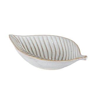 Off-white ceramic leaf-shaped dish with brown glaze detailing resembling leaf veins.