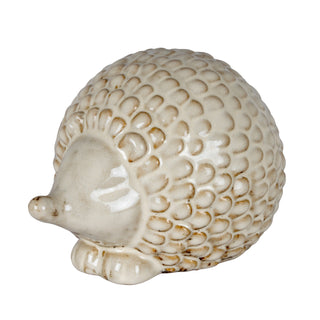 Cream ceramic hedgehog decoration with textured quills and brown glaze accents.