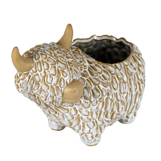 Ceramic highland cow planter shown from the side, detailing the textured glaze finish and tan horns.