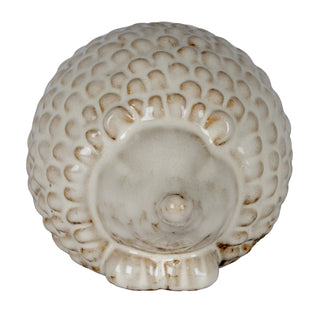 Plain front-on product shot of the ceramic hedgehog, detailing the snout and textured, cream-glazed quills.