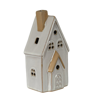 Glazed white ceramic house with rustic brown edging, featuring a tall chimney and detailed cut-out windows and door.