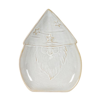 Front view of the ceramic Santa dish. It is off-white with an embossed face, beard, and a pointed hat decorated with stars.