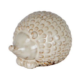 Small ceramic hedgehog decoration, cream glaze with textured spines, viewed from the side.