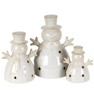 Three glazed ceramic snowmen decorations of varying sizes displayed together on a white background.
