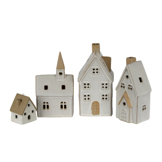 Four ceramic town buildings showing the varying sizes and designs.