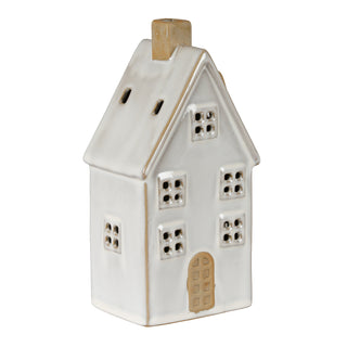 Angled view of the white ceramic house showing the front door, side windows, and the beige chimney top.