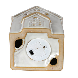 Rear view of the ceramic townhouse showing the round LED light mechanism inserted into the back wall.