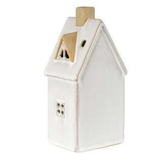 Glossy white ceramic house viewed from the side, showing the beige chimney and distressed edge detailing.