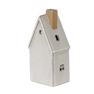 Glazed ceramic townhouse showing the arched side window, circular gable hole, and rectangular roof vent.