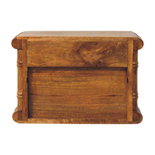 Rear view of the amber oak bedside table, showing the solid back panel and carved bamboo-style posts.