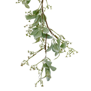 Vertical close up of the garland showing the drape of the soft green leaves and small white berries.