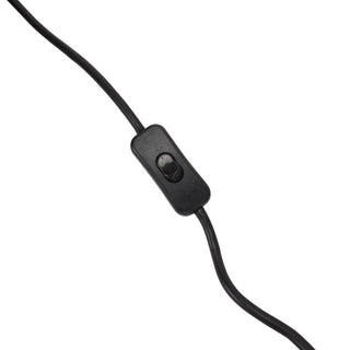 Close-up detail of the black plastic inline rocker switch located on the power cable of the table lamp.