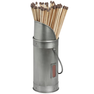 Cylindrical antique pewter match holder filled with long brown-tipped matches. Striker pad and handle visible.