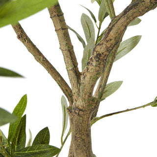 Close-up detail of the artificial olive tree trunk and branching structure, showing the textured bark.