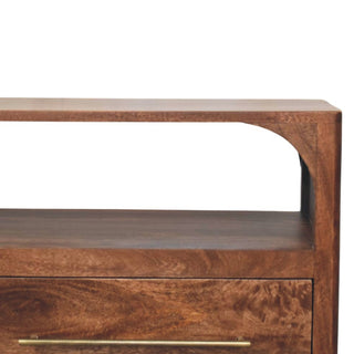 Curved corner detail of the upper open shelf on the dark wood media console, showing rich grain texture.