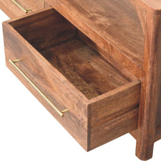 Close-up of the media console showing a drawer pulled out, revealing the internal wooden construction.