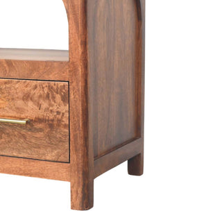 Close-up of the media console's side panel, drawer, and short wooden legs.