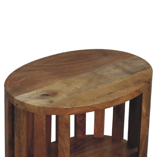 Close-up of the round wooden tabletop surface highlighting the natural grain and colour variation.