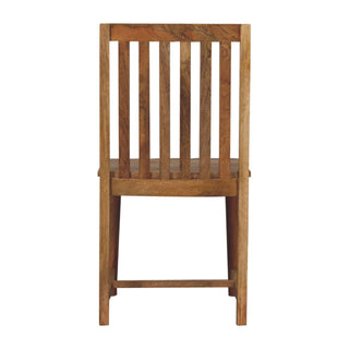 Rear view of the wooden dining chair with vertical slat back and lower stretcher.