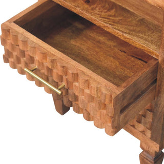 Detail of the golden teak bedside table showing the top drawer pulled open, revealing the interior storage space.