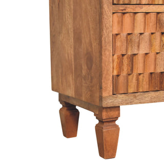 Detail view of the turned teak legs supporting the chest, showing the side panel and base frame.