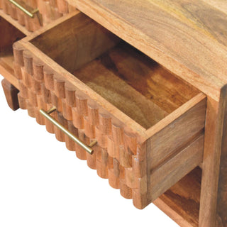 Close up of the golden teak drawer pulled open, showing the internal construction and rich wood grain inside.