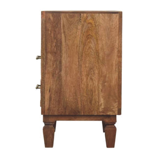 Profile view of the golden teak bedside cabinet, showing the deep wood grain and turned feet.