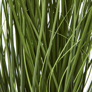 Dense arrangement of artificial green agapanthus leaves, showing texture.