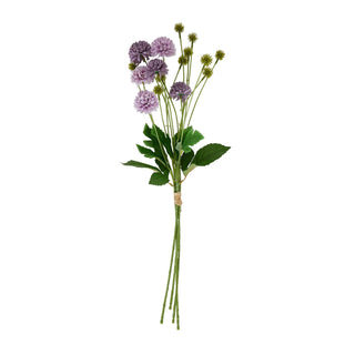 Full view of the artificial bouquet showing purple flowers, green leaves, and tied stems.