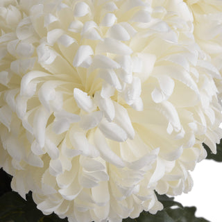 Close-up of the artificial white chrysanthemum bloom, showing the dense arrangement of creamy white petals.