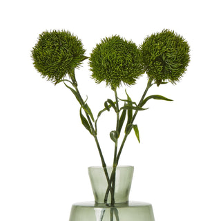 Three artificial dark green dianthus stems displayed in a small tinted glass vase.