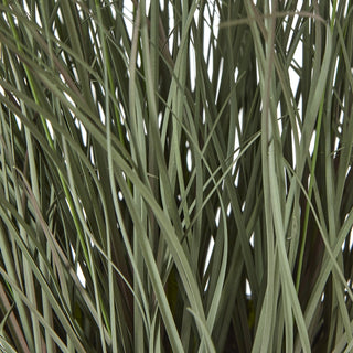 Extreme close-up showing the dense, thin blades of artificial fountain grass foliage.