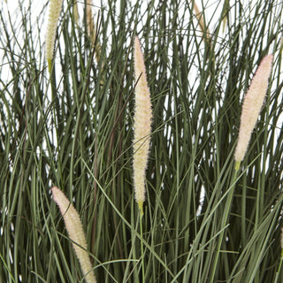 Artificial dark green fountain grass blades and pale pink-tipped flower spikes, close-up detail.