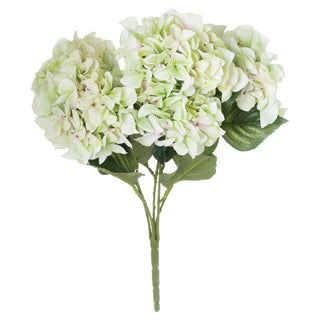 Plain studio shot of an artificial bouquet with three large pale green hydrangea flower heads.