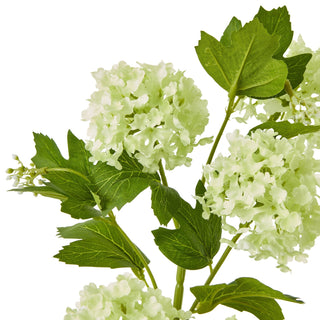 Close detail of the artificial viburnum snowball flowers and textured green leaves.