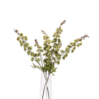 Artificial green hops stems displayed as a bouquet in a tall, clear vase.