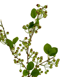 Close-up of the artificial mossberry clusters, highlighting the reddish-brown tips on the pale green fruit.
